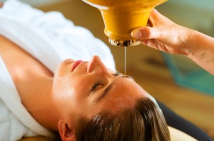 Woman enjoying a Ayurveda oil massage